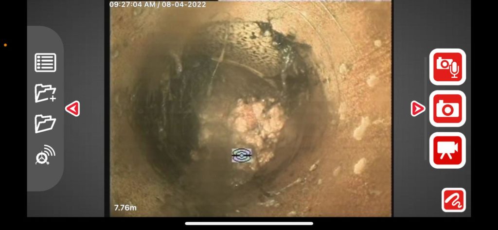 This CCTV inspection found fat and tree roots inside sewage pipe